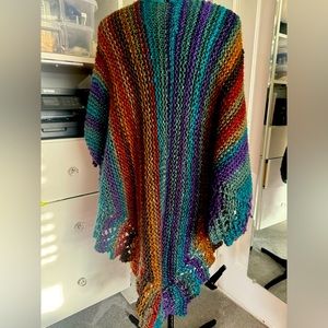 Hand knitted poncho.  Different in each side